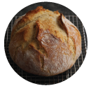 loaf of bread on a black table