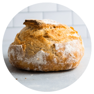 loaf of bread in front of a white background
