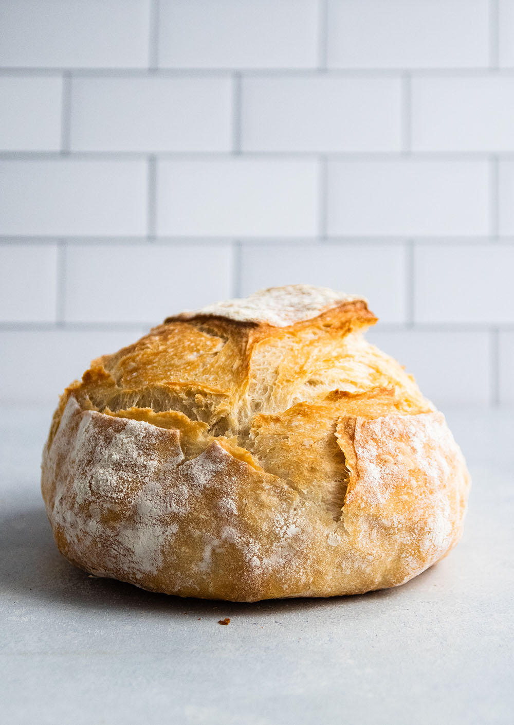 Loaf of bread on a white table.