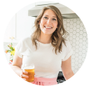 Woman standing in a kitchen with white walls